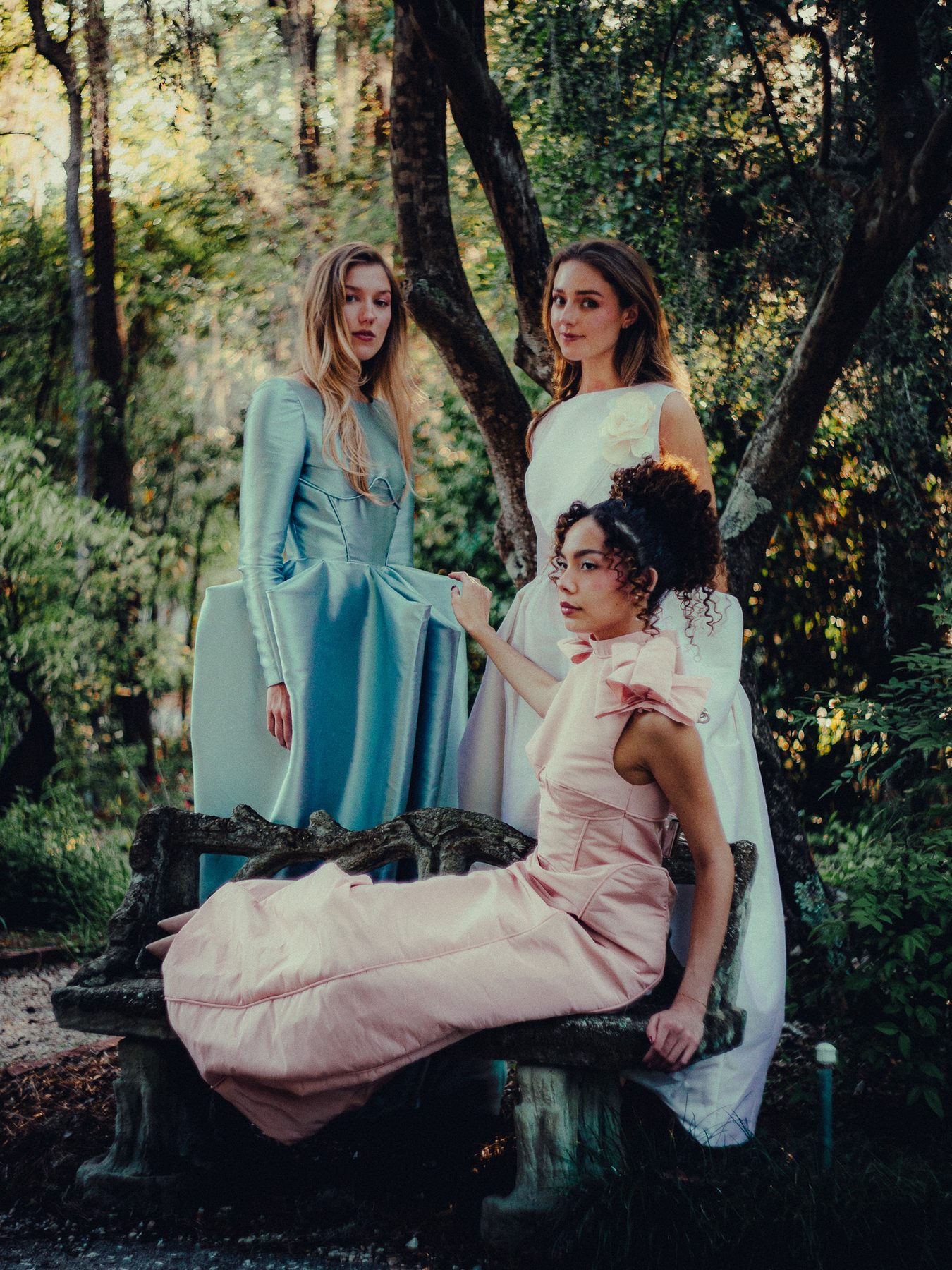 Three gowns in the garden