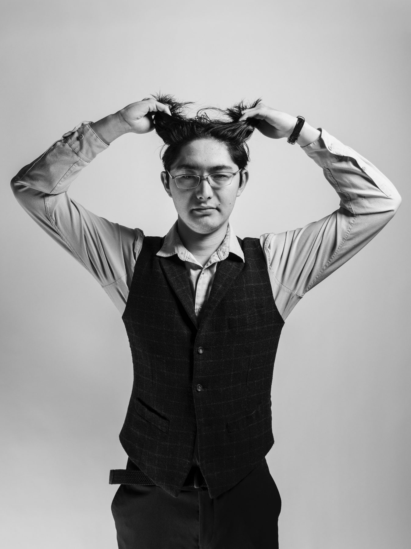 Studio portrait, hands in hair